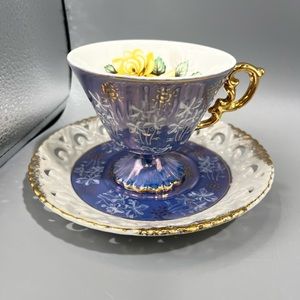 Royal Sealy tea cup and saucer set. delicate iridescent blue & white design